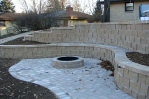 retaining-wall-fire-pit-a-nook-created-by-the-curving-retaining-wall-is-used-for-a-patio-with-fire